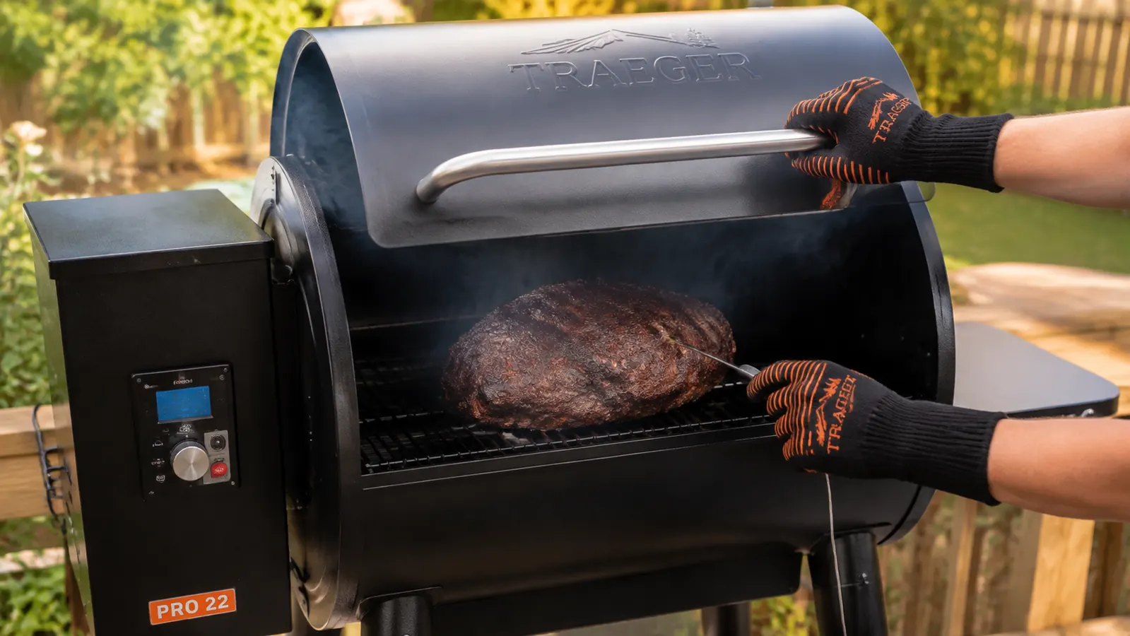 A hand checking the internal temperature on a pork shoulder resting on a pellet smoker grate
